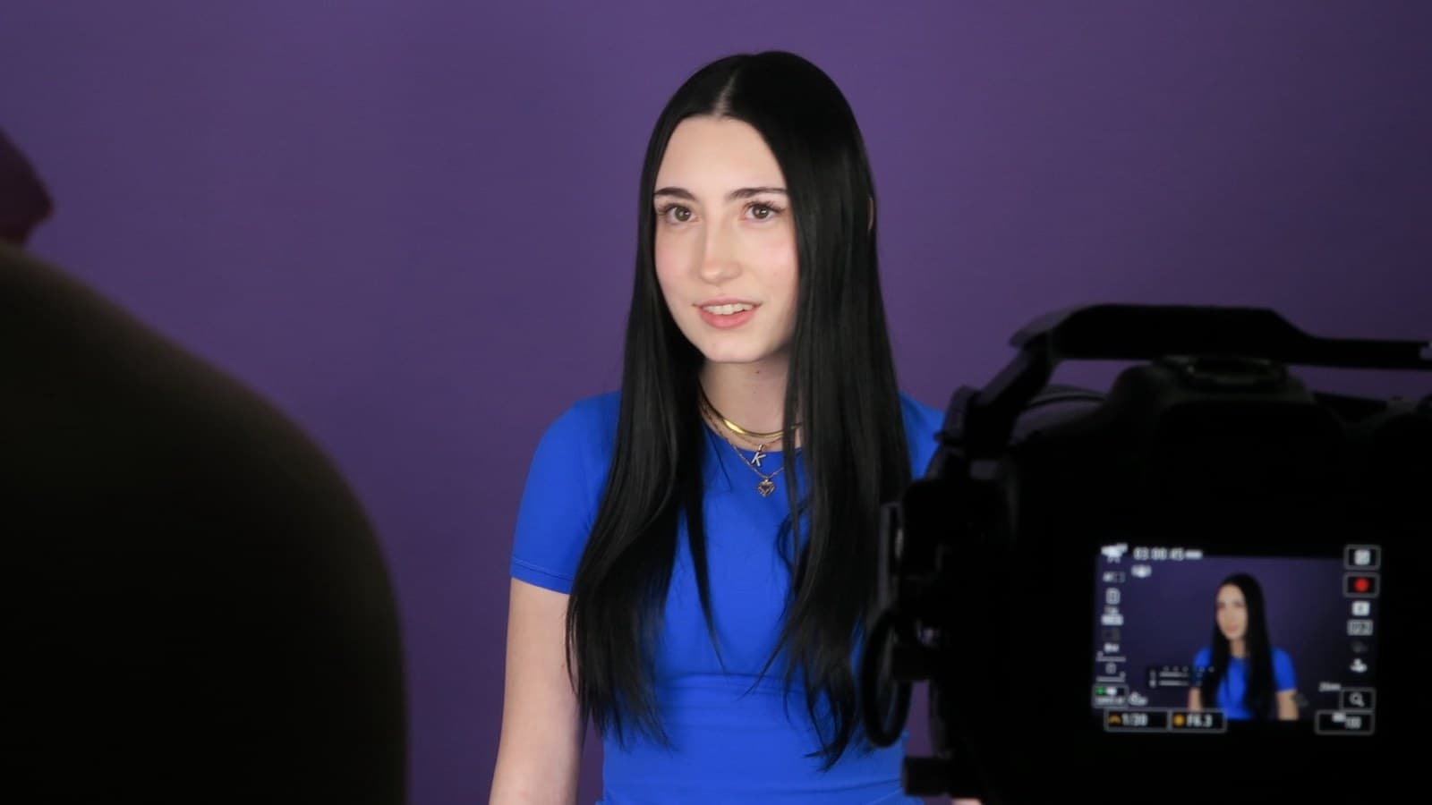An actor on camera under studio lights